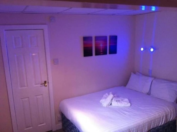 Imagen de la habitación del Hotel The New Royal Windsor. Foto 11