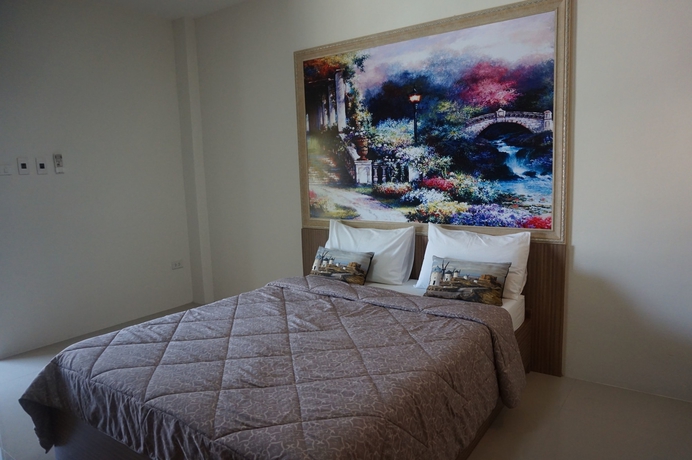 Imagen de la habitación del Hotel The Nine Mansion. Foto 6