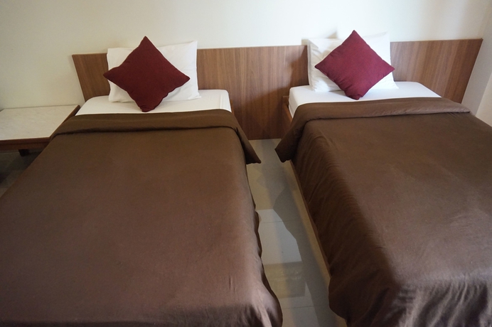 Imagen de la habitación del Hotel The Nine Mansion. Foto 10