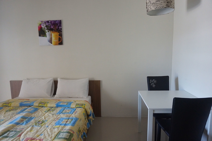 Imagen de la habitación del Hotel The Nine Mansion. Foto 11