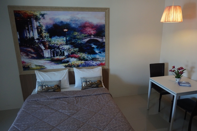 Imagen de la habitación del Hotel The Nine Mansion. Foto 18