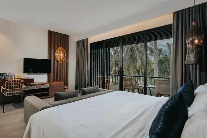 Imagen de la habitación del Hotel The Ning Resort Ubud. Foto 14