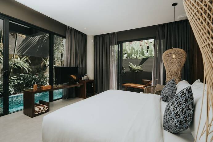 Imagen de la habitación del Hotel The Ning Resort Ubud. Foto 16