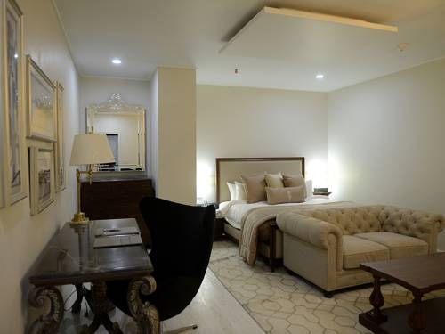 Imagen de la habitación del Hotel The Nishat. Foto 7