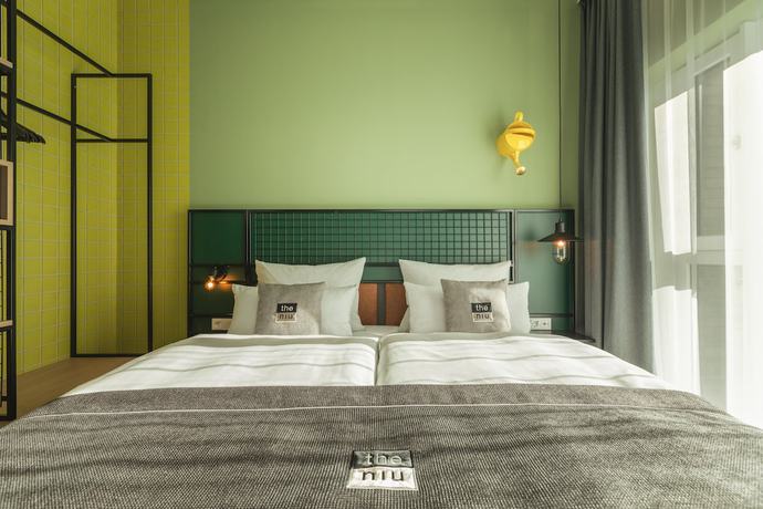 Imagen de la habitación del Hotel The Niu Dwarf. Foto 2