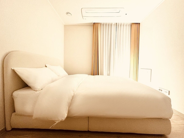 Imagen de la habitación del Hotel The November Stay Guri. Foto 5