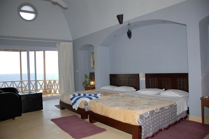 Imagen de la habitación del Hotel The Oasis Dive Resort. Foto 18