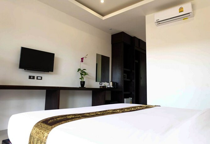 Imagen de la habitación del Hotel The Oasis Khaolak Resort. Foto 26