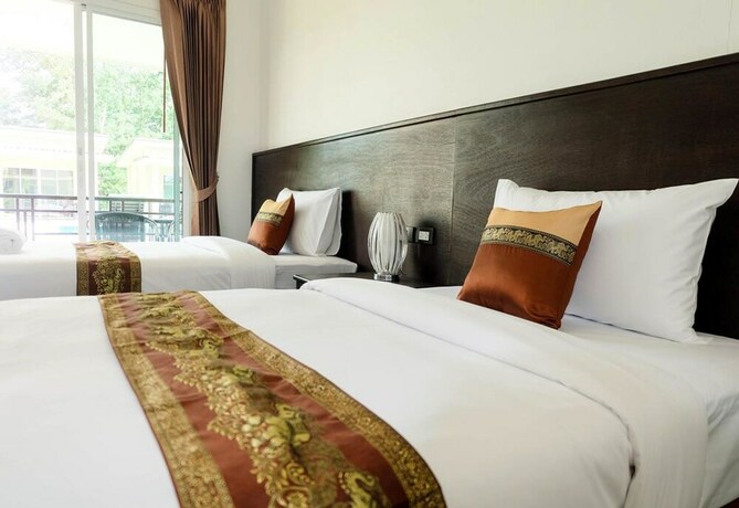Imagen de la habitación del Hotel The Oasis Khaolak Resort. Foto 34