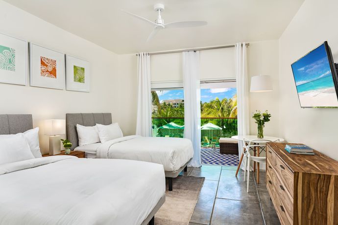 Imagen de la habitación del Hotel The Oasis at Grace Bay. Foto 8