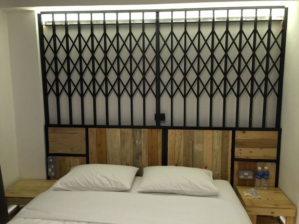 Imagen de la habitación del Hotel The Oikos. Foto 11