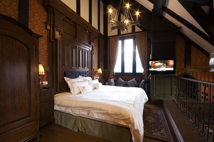 Imagen de la habitación del Hotel The Old England Manor. Foto 17