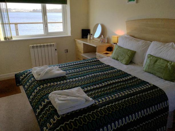 Imagen de la habitación del Hotel The Old Quay House. Foto 8