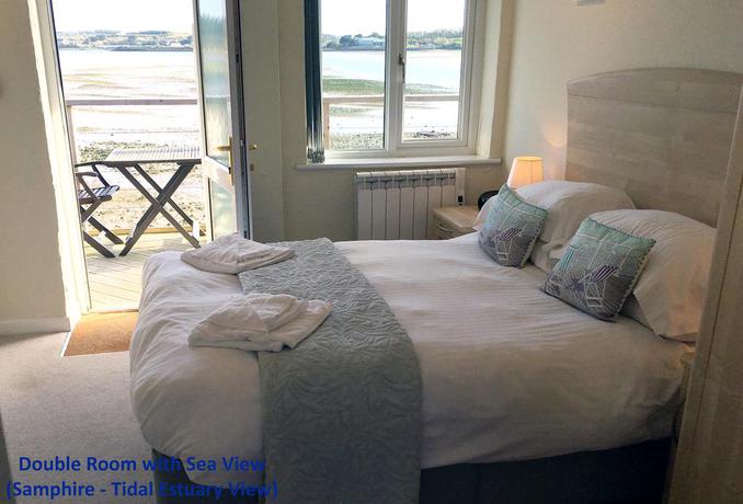 Imagen de la habitación del Hotel The Old Quay House. Foto 12