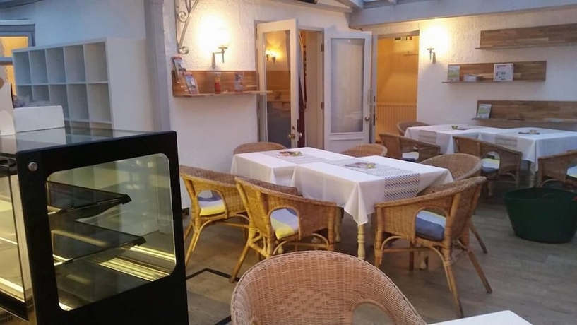 Imagen del bar/restaurante del Hotel The Old Well Inn. Foto 7