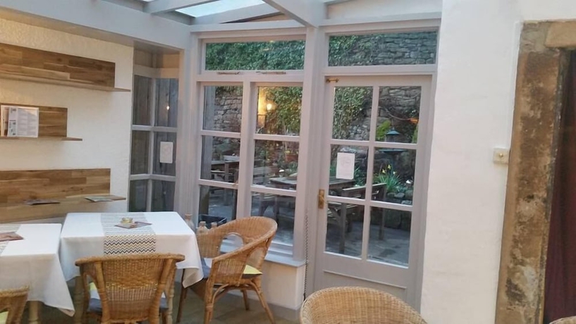 Imagen del bar/restaurante del Hotel The Old Well Inn. Foto 8