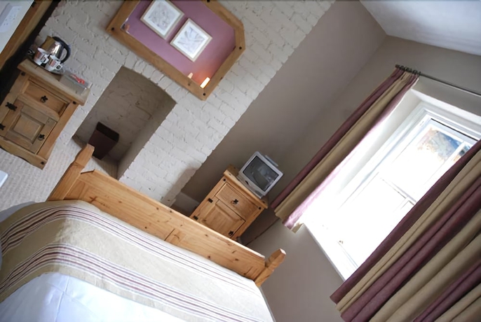 Imagen de la habitación del Hotel The Olde Coach House. Foto 7