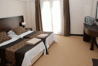 Imagen de la habitación del Hotel The One Club. Foto 6