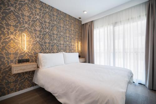 Imagen de la habitación del Hotel The Orange House Boutique. Foto 8