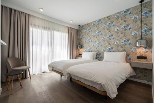 Imagen de la habitación del Hotel The Orange House Boutique. Foto 10