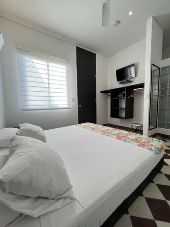 Imagen de la habitación del Hotel The Orange House, Santa Marta. Foto 15