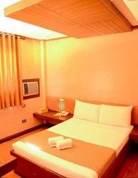 Imagen de la habitación del Hotel The Orange Place San Juan. Foto 12
