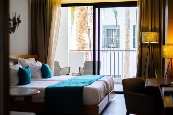 Imagen de la habitación del Hotel The Orangers Garden Villas and Bungalows. Foto 8