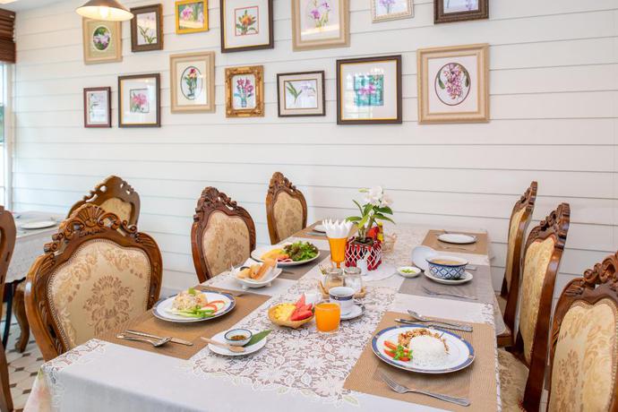 Imagen del bar/restaurante del Hotel The Orchid House 153. Foto 2