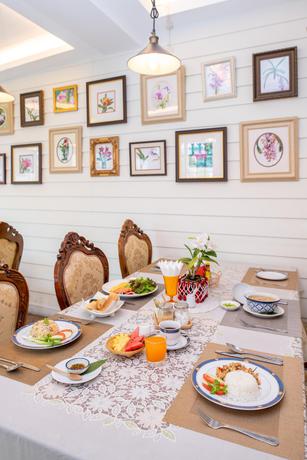 Imagen del bar/restaurante del Hotel The Orchid House 153. Foto 3