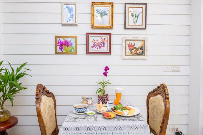 Imagen del bar/restaurante del Hotel The Orchid House 153. Foto 5