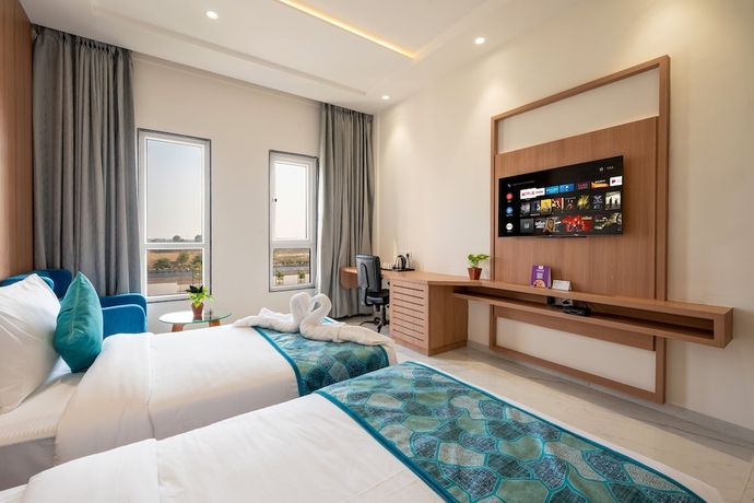Imagen de la habitación del Hotel The Orchid Jamnagar. Foto 4