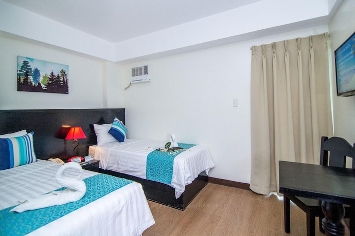 Imagen de la habitación del Hotel The Orient Beach Boracay. Foto 5