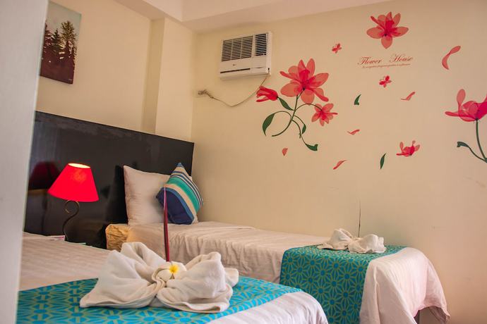 Imagen de la habitación del Hotel The Orient Beach Boracay. Foto 6