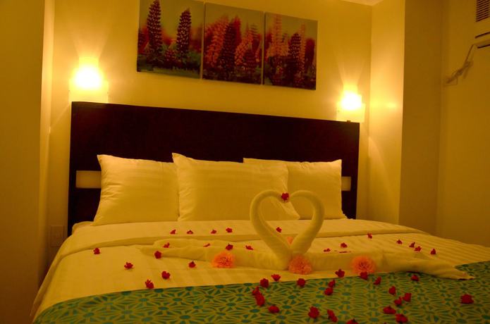 Imagen de la habitación del Hotel The Orient Beach Boracay. Foto 7
