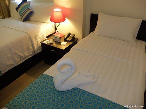Imagen de la habitación del Hotel The Orient Beach Boracay. Foto 10