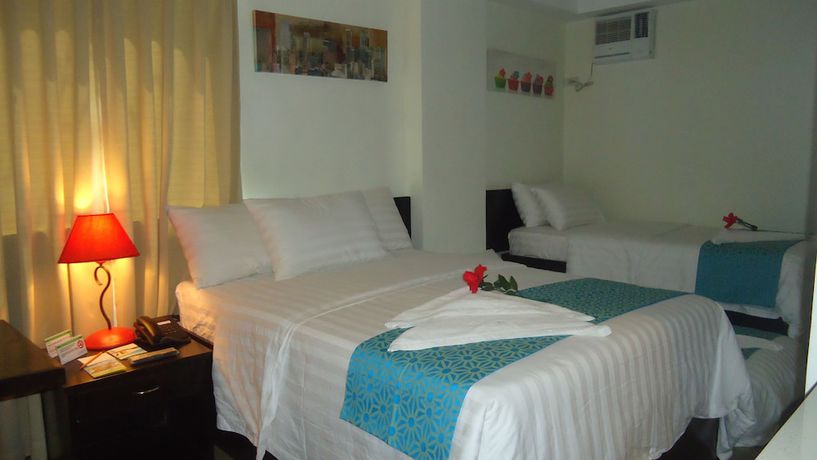 Imagen de la habitación del Hotel The Orient Beach Boracay. Foto 11
