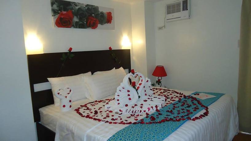 Imagen de la habitación del Hotel The Orient Beach Boracay. Foto 13