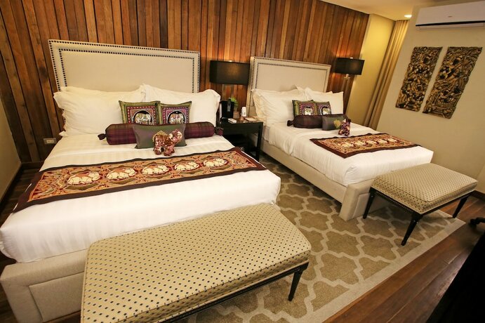 Imagen de la habitación del Hotel The Oriental Luxury Suites Tagaytay. Foto 11