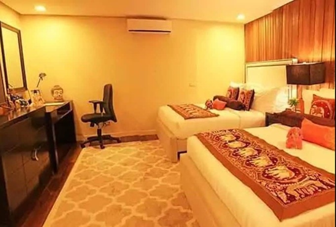 Imagen de la habitación del Hotel The Oriental Luxury Suites Tagaytay. Foto 18