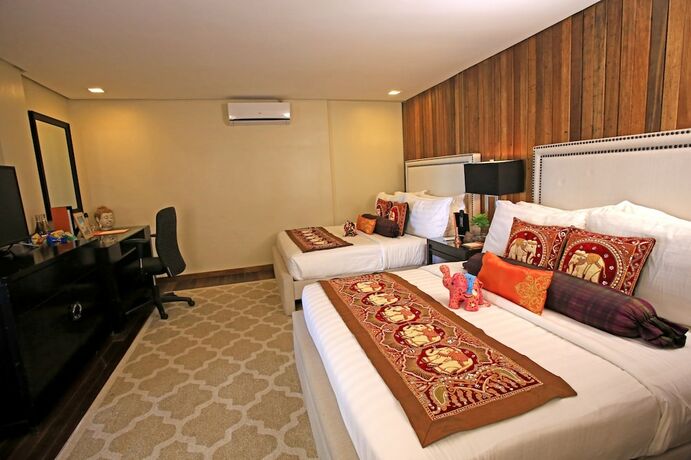 Imagen de la habitación del Hotel The Oriental Luxury Suites Tagaytay. Foto 19