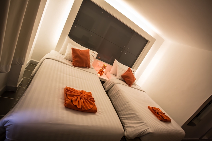 Imagen de la habitación del Hotel The Original Orange Rooms. Foto 6