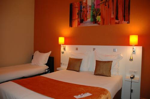 Imagen de la habitación del Hotel The Originals Boutique, De L'univers, Montluçon. Foto 2