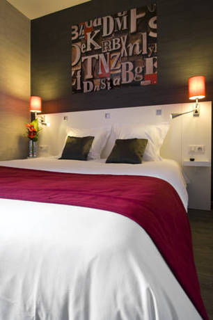 Imagen de la habitación del Hotel The Originals Boutique, De L'univers, Montluçon. Foto 4