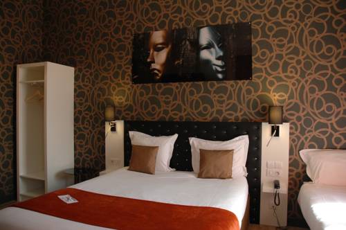 Imagen de la habitación del Hotel The Originals Boutique, De L'univers, Montluçon. Foto 12