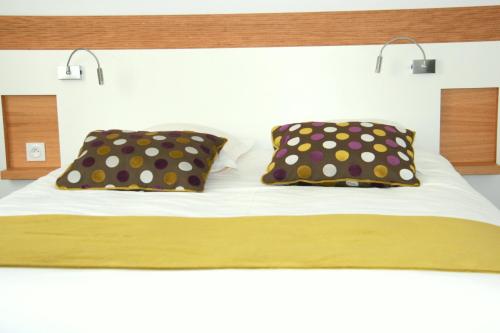 Imagen de la habitación del Hotel The Originals Boutique, De Perros. Foto 9