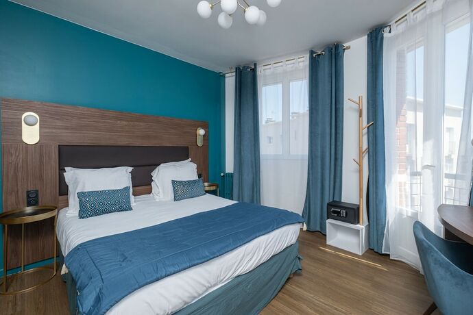 Imagen de la habitación del Hotel The Originals Boutique, Hôtel Le Marignan,Le Havre Centre Gare. Foto 12