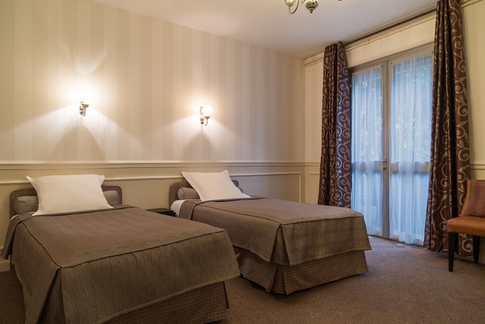 Imagen de la habitación del Hotel The Originals Boutique, Hostellerie Des Trois Pigeons. Foto 10