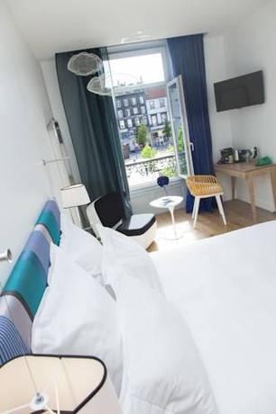 Imagen de la habitación del Hotel The Originals Boutique, Le Lion, Clermont-ferrand. Foto 14