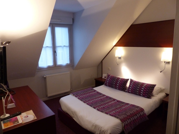 Imagen de la habitación del Hotel The Originals Boutique, Le Lion D'or. Foto 5