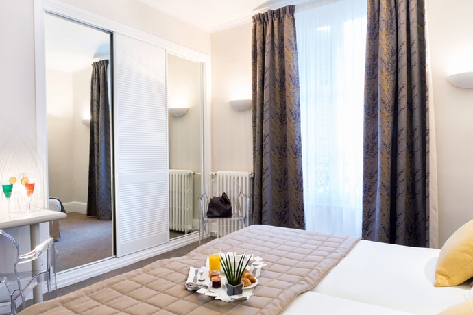 Imagen de la habitación del Hotel The Originals Boutique, Les Nations, Vichy. Foto 3